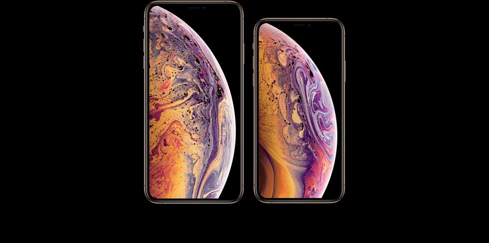 iPhone XSとiPhone XS Max、それぞれの画面が横に並んでおり、その画面上には紫・ピンク・オレンジのマーブル模様がきれいなバブル（1/2）が写っている
